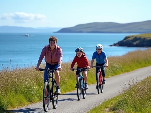 A family cycling along a coastal path with Galway Bay in the background.